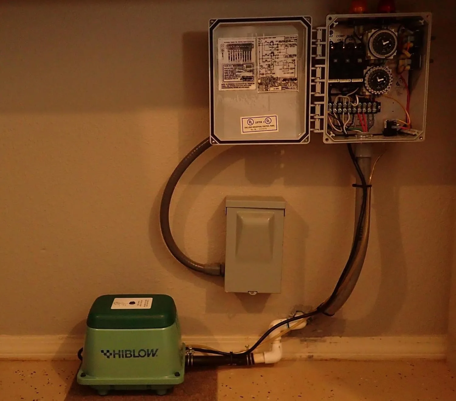 Customer photo of septic air pump installation showing the pump unit mounted in position