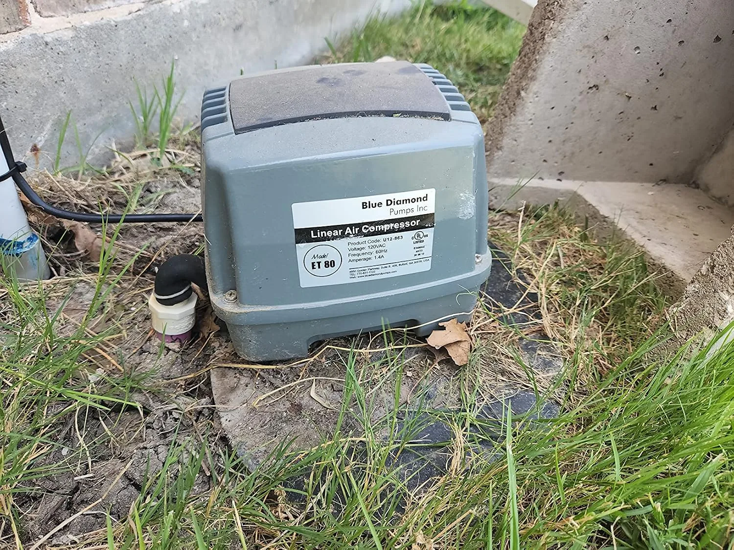 Customer photo of aerobic system air pump showing internal components and replacement parts