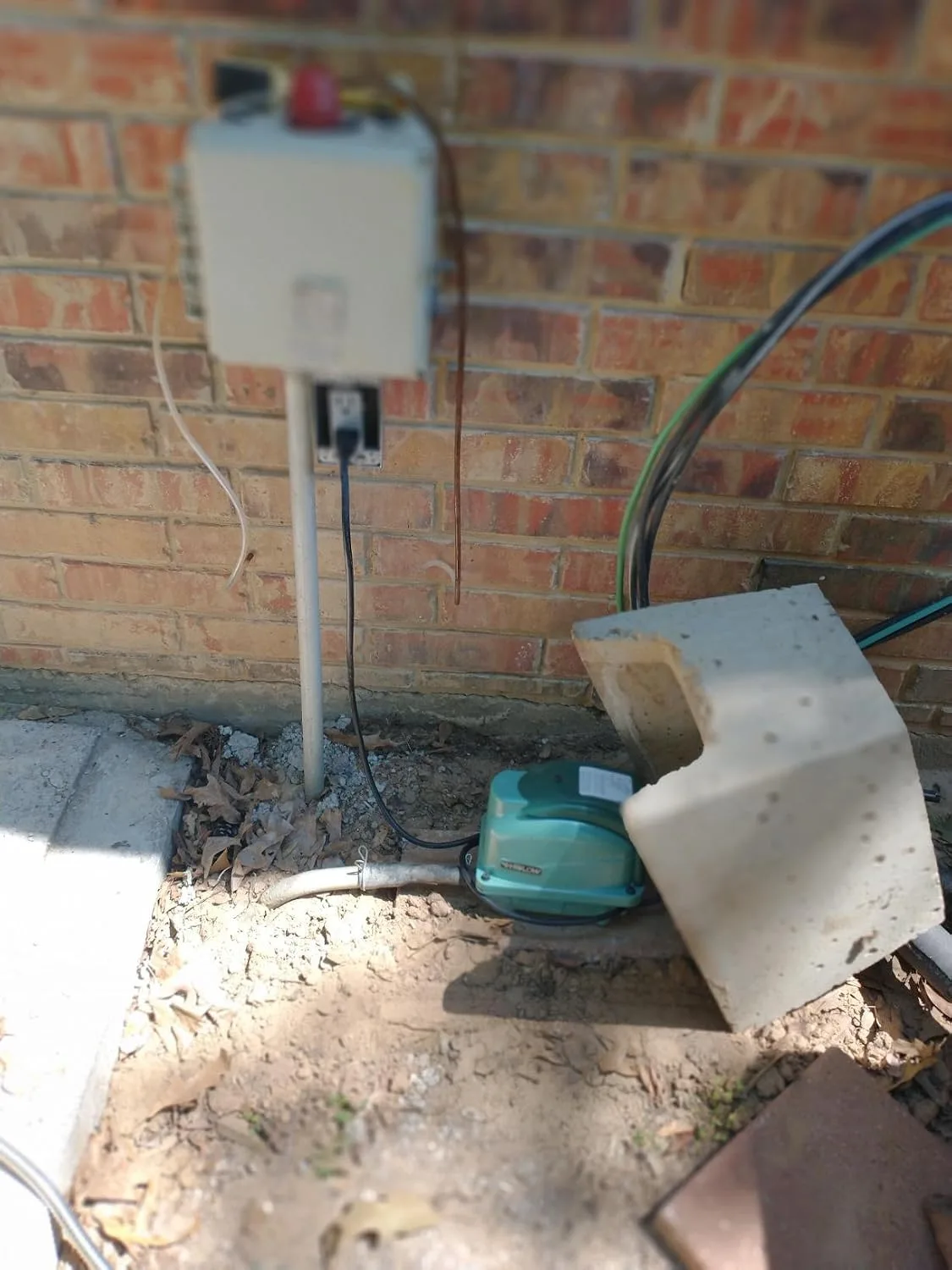 Customer photo of aerobic treatment unit installation showing the tank and system components
